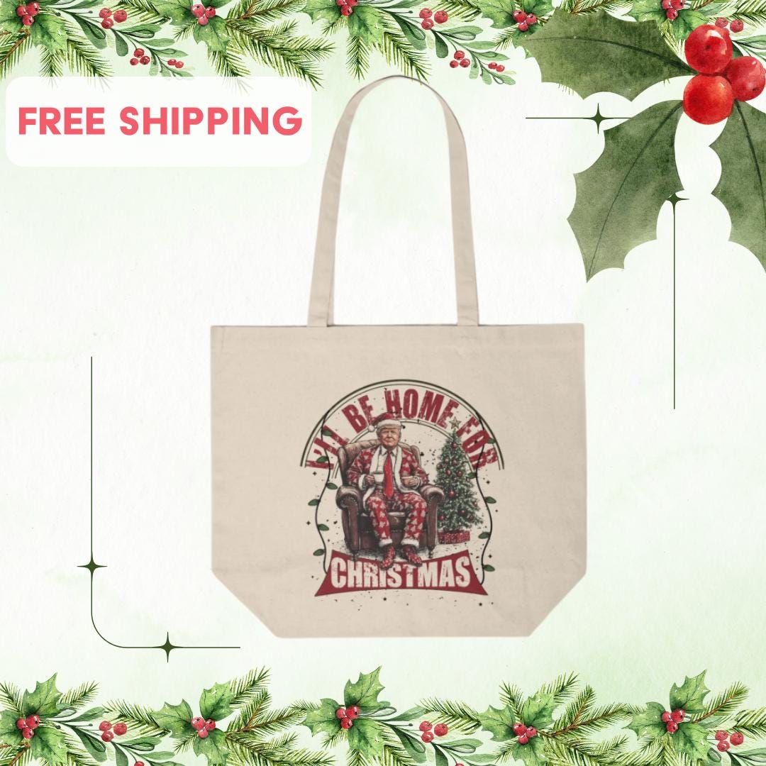 Natural color canvas tote bag that says I’ll be home for Christmas with President Trump and a suit and Santa hat with a Christmas tree and Christmas lights, free shipping.